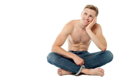Shirtless young man thinking something Stock Photos
