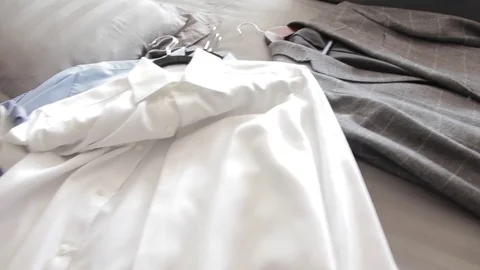 Shirts and coat in the bed Video stock 85072251
