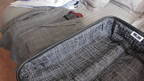 Shirts and coat in the bed Stock Footage 85072257