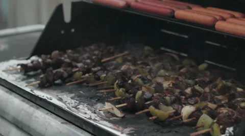 Shish kabobs' on the grill (mid shot) Video stock 35225562