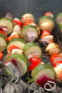 Shish-kebab cooking on barbecue Stock Photos