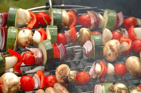 Shish-kebab cooking on barbecue Stock Photos
