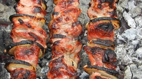Shish kebab (meat) on the fire of coals and smoke. Stock Footage 65294502