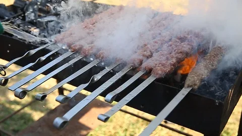 Shish kebab. Pork or lamb meat pieces being fried on a charcoal grill. Frying Stock Footage 129013682