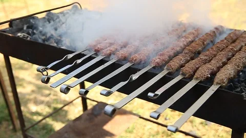 Shish kebab. Pork or lamb meat pieces being fried on a charcoal grill. Frying Stock Footage 129014238
