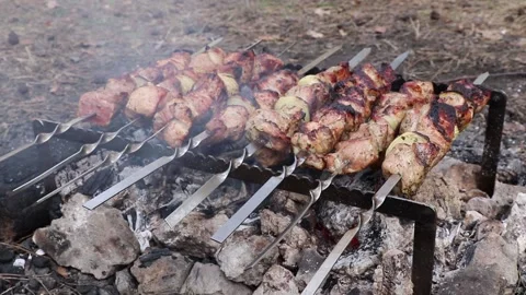 Shish kebab. Pork or lamb meat pieces being fried on a charcoal grill. Stock Footage 142682659