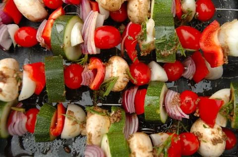 Shish-kebab prepared for cooking on barbecue Stock Photos