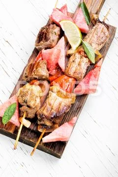Shish kebab with watermelon garnish Stock Photos