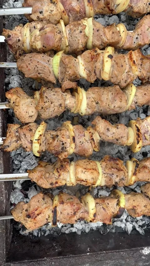 The shish kebab will sear over an open fire. Stock Footage 328425872
