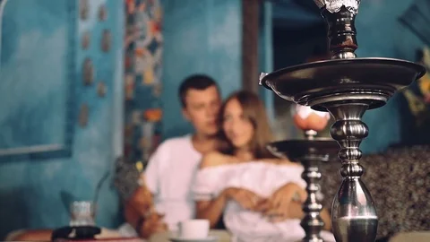 Shisha closeup, couple in background, changing focus Stock Footage 71387092