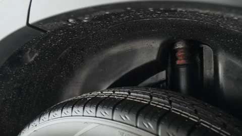 Shock absorber and wheel arch. Power Meets Elegance, High-Performance Wheel and Stock Footage 257764372