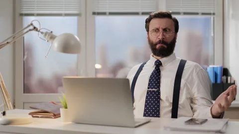Shock, failure, problem concept. Nervous, irritated man looks at computer and Vidéo 265944914