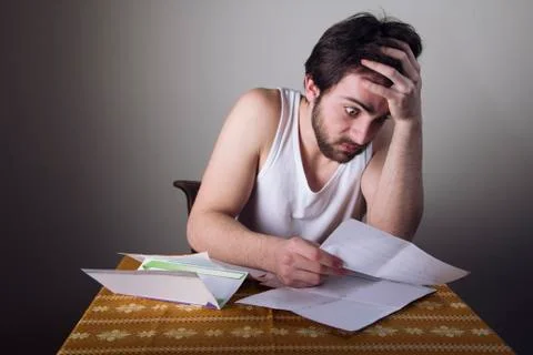 In shock with his electricity or cable bills Stock Photos