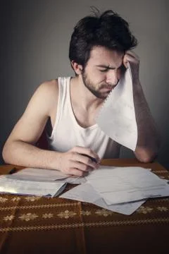 In shock with his electricity or cable bills Stock Photos