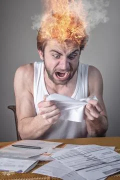 In shock with his electricity or cable bills Stock Photos