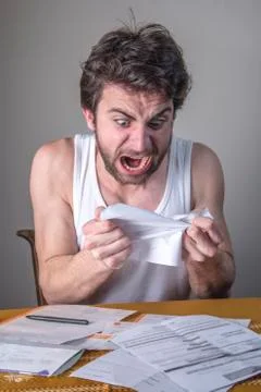In shock with his electricity or cable bills Stock Photos