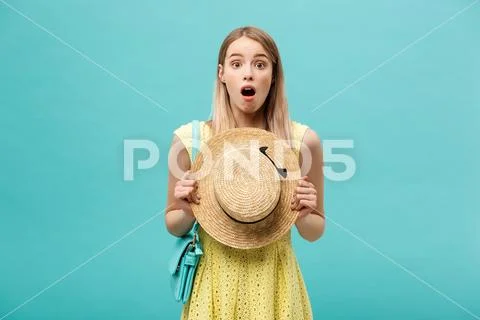 Shock or Good news Concept: Young slender blond girl with long hair in a hat Stock Photos