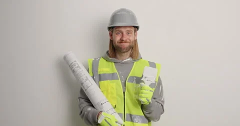 Shocked bearded man atchitect stares surprisingly at camera reacts on receieved Stock Footage 155857833