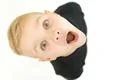 The shocked boy look to the camera. View from above Photo