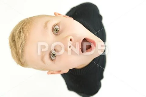 The shocked boy look to the camera. View from above Stock Photos