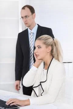 Shocked business people looking depressed on computer received a bad message. Stock Photos