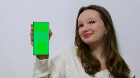 Shocked Caucasian female looking at cellphone read unbelievable astonish news Stock-Footage 295283053