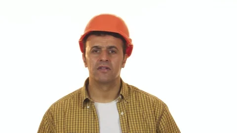 Shocked construction worker removing his hardhat in disbelief Stock Footage 311989402