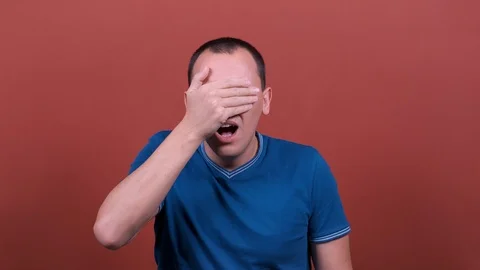 Shocked man Looking at camera with scared look, fearful glance. man emotion Stock Footage 123002326