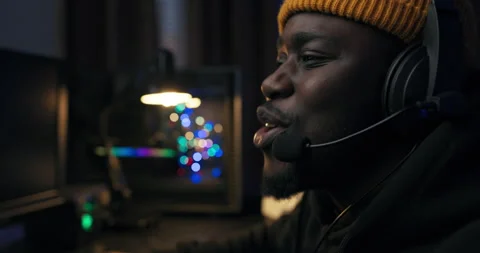 A shocked man is playing an emotional computer game, reliving the rounds 스톡 동영상 178568128