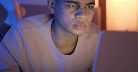 Shocked man using laptop late night Stock Footage 145290211