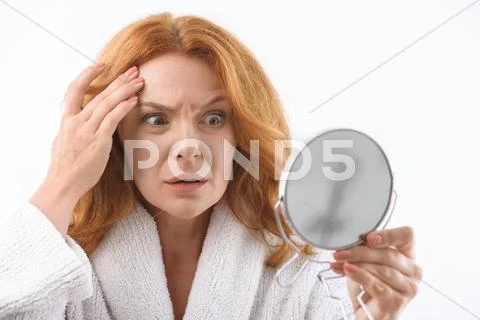 Shocked mature lady is afraid of aging Stock Photos