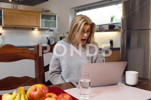 Shocked Middle-Aged Woman With Laptop
