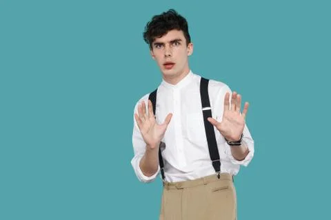 Shocked or scared man blocking with hands and looking at camera. Foto stock
