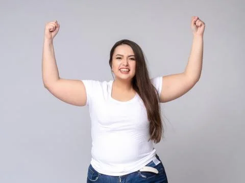 Shocked Plus Size Model with long hair posing in studio. Stock Photos