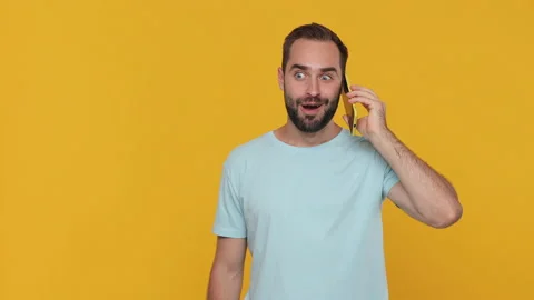 Shocked surprised young man in basic casual blue t-shirt say wow hold in hand Video stock 148291222