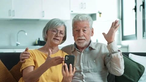Shocked upset elderly couple getting bad news, finding fraud, money stealing, lo Stock Footage 237939818