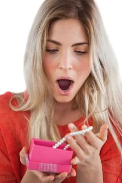 Shocked woman discovering necklace in a gift box Stock Photos