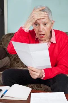 Shocking amount of bills an old lady has to pay for Stock Photos