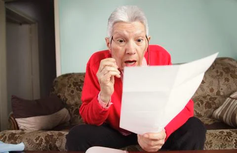 Shocking amount of bills an old lady has to pay for Stock Photos
