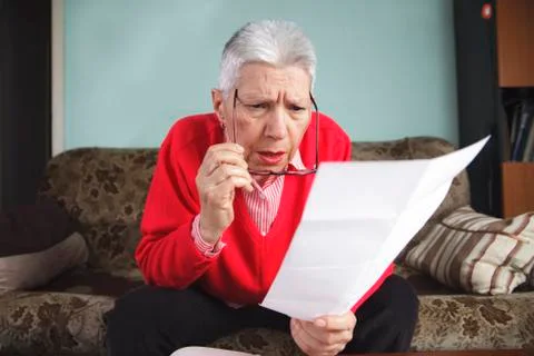 Shocking amount of bills an old lady has to pay for Stock Photos