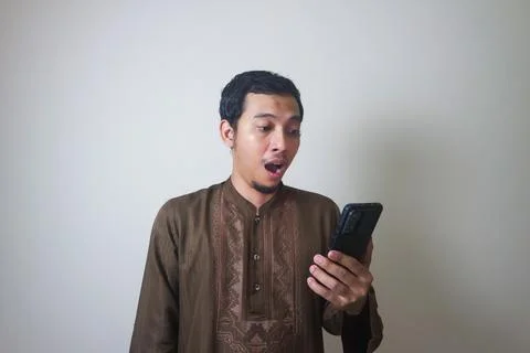 Shocking while using smartphone Stock Photos