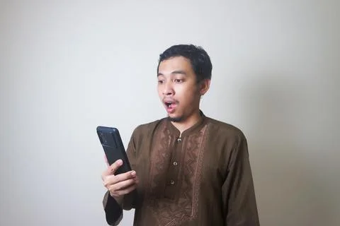 Shocking while using smartphone Stock Photos