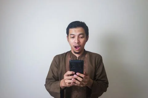 Shocking while using smartphone Stock Photos