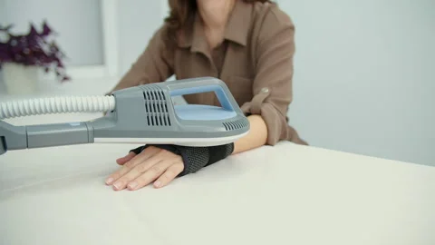 Shockwave therapy applied to patient hand in cast Stock Footage 325853340