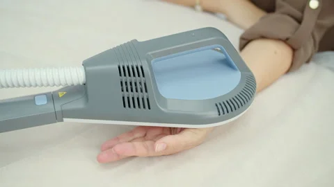 Shockwave therapy applied to patient hand in clinic Stock Footage 325853841