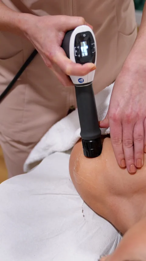 Shockwave Therapy Device in Action on Patient's Shoulder Stock Footage 271351078