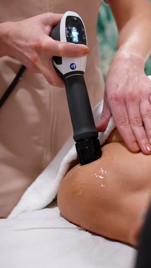 Shockwave Therapy Device in Action on Patient's Shoulder Stock Footage 271351134