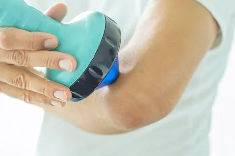Shockwave therapy on elbow Stock Photos