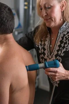 Shockwave Therapy Middle Back Stock Photos