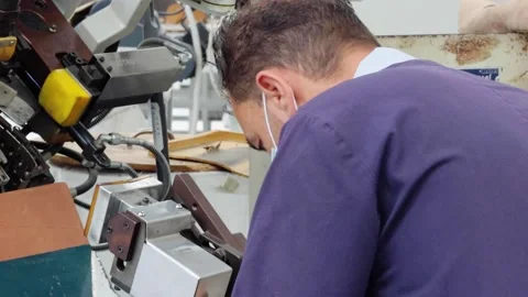 Shoe Factory - Shoes making process with worker Stock Footage 136729728